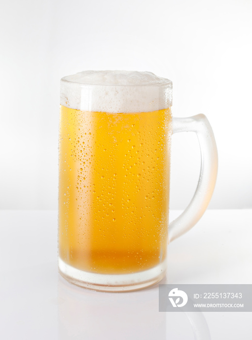 Delicious and refreshing beer mug on white background