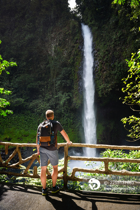 Tourist looking at the La Fortuna Waterfall in Costa Rica