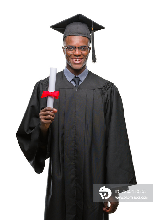 Young graduated african american man holding degree over isolated background with a happy face standing and smiling with a confident smile showing teeth