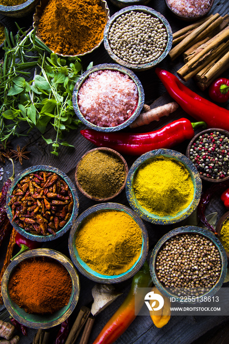 Variety of spices and herbs on kitchen table