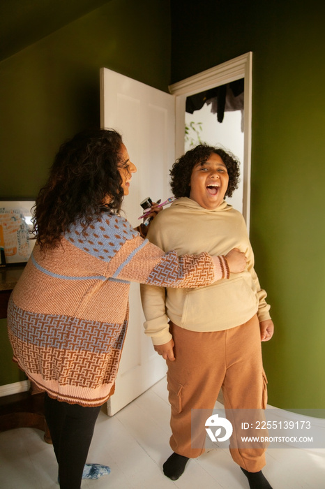 Curvy mother having fun with her son in the bathroom