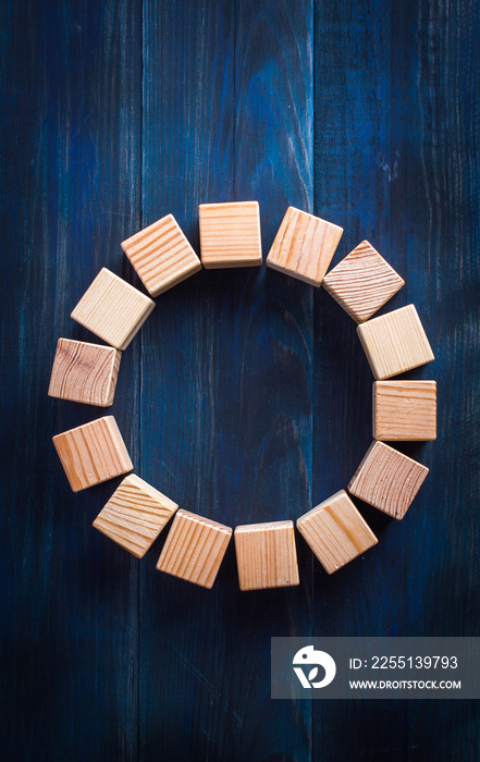 wooden blocks on a blue wooden background