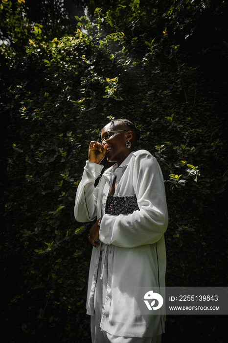 portrait of black woman basking in sunlight