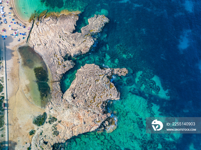 Ibiza Cala Bassa beach with turquoise water, aerial views