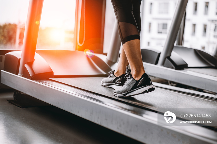 Close up on shoe,Women running in a gym on a treadmill.exercising concept.fitness and healthy lifestyle