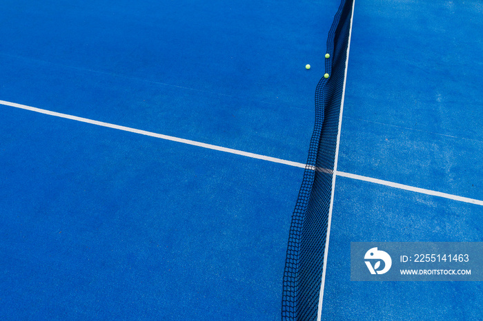 blue paddle tennis court aerial shot by drone