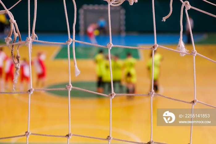 Football defocused player penalty on field, Futsal ball field in the gym indoor, Soccer sport field