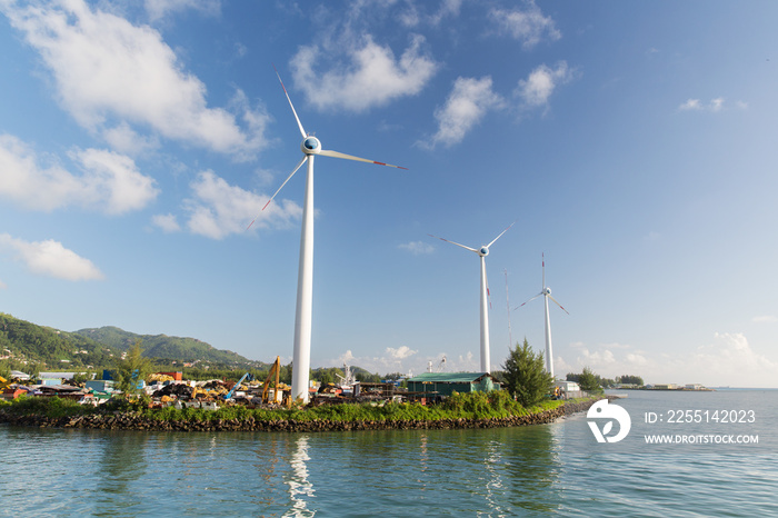 turbines at wind farm on sea shore