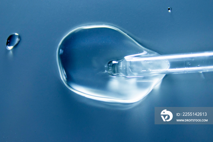 Liquid gel or serum on a microscope screen on a white background