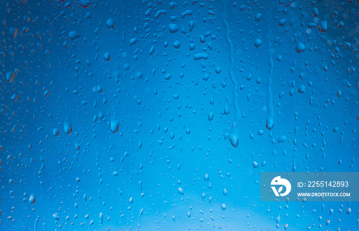 Blue water drops background. Blue water drops on a boat glass background