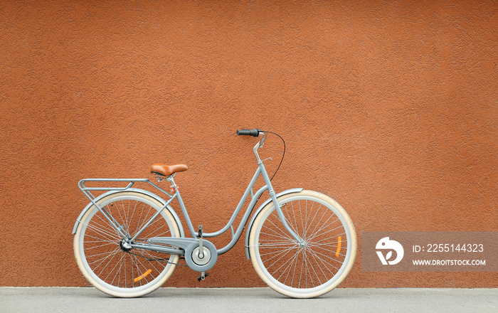 Retro bicycle near color wall