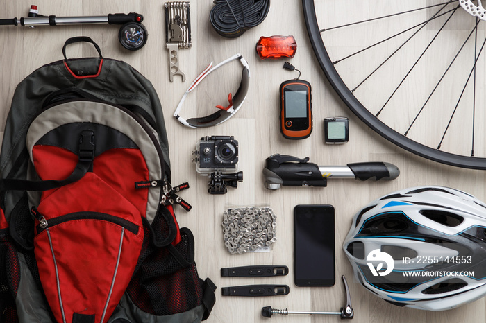 Wheel, steering wheel, seat, helmet, tire, sunglasses, reflective tape, backpack.