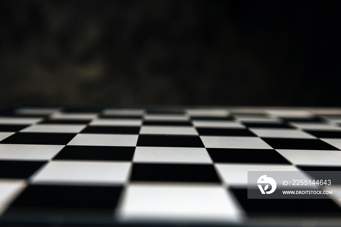 abstract blurred black and white chess board game competition on dark background, chess battle, business management, leadership success, team leader, teamwork, business strategy planning concept