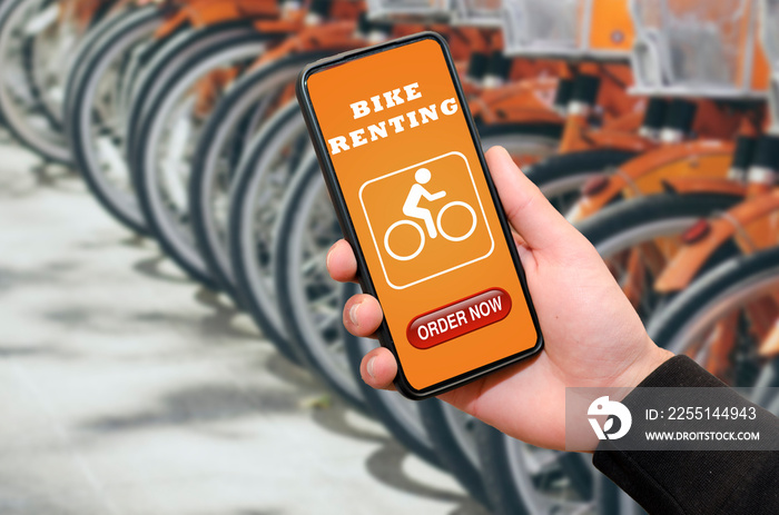 Person using bike rental app on mobile phone