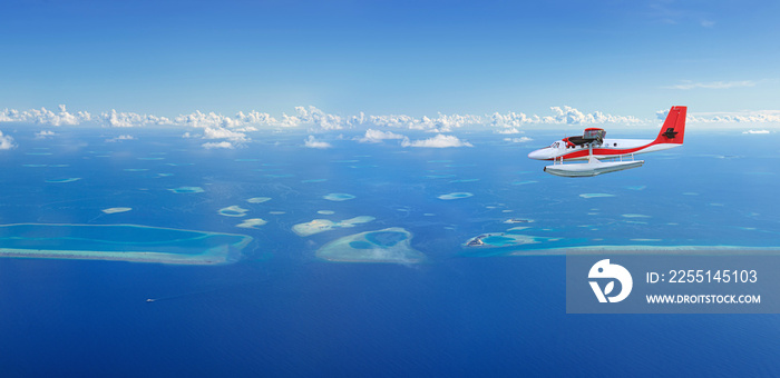 Seaplane flies over Maldives island