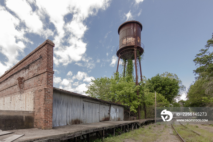 Giant water tower looms of abandoned factory