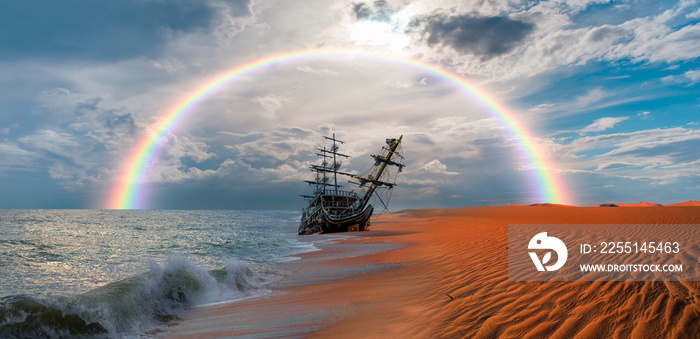 The thrown old ship has sat down on a bank - Namib desert with Atlantic ocean meets near Skeleton coast with rainbow - Namibia, South Africa