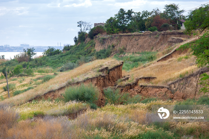 Soil landslide on slopes after degradation of the soil rain or underground water and an earthquake on summer day.