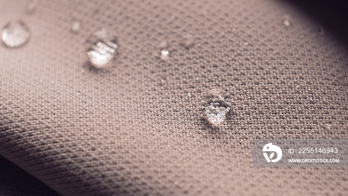 water beading on fabric. Waterproof coating background with water drops. soft focus, blur