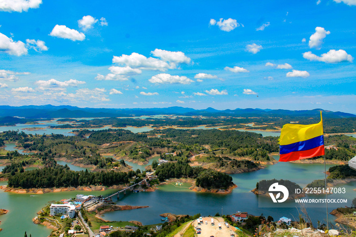 View of the Guatape dam with the Colombian flag waving, Guatape, Antioquia, Colombia.