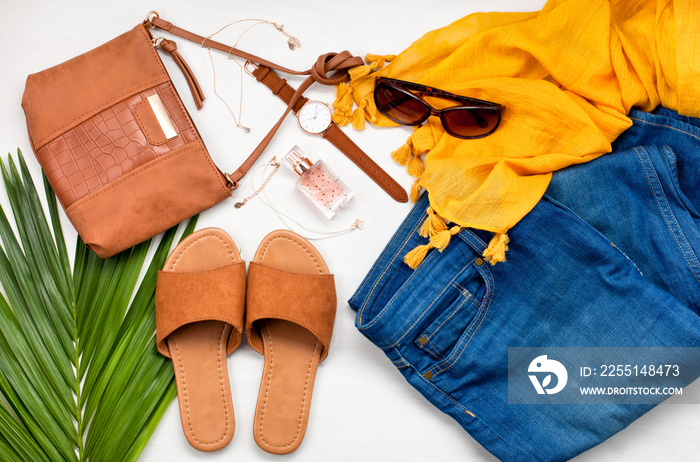 Summer street urban style. Fashion summer girl clothes set, accessories. Trendy sunglasses, slippers, handbag clutch,  watch, jeans, scarf. Summer lady. Creative urban overhead summer top view