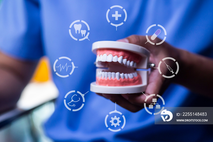 Professional doctor dentist holding dental with teeth icons, Health, dentistry concept.