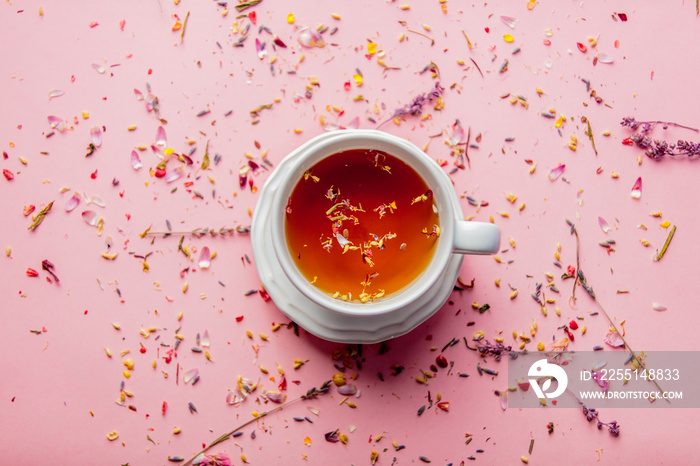 Cup of tea with lavender leaves and petals