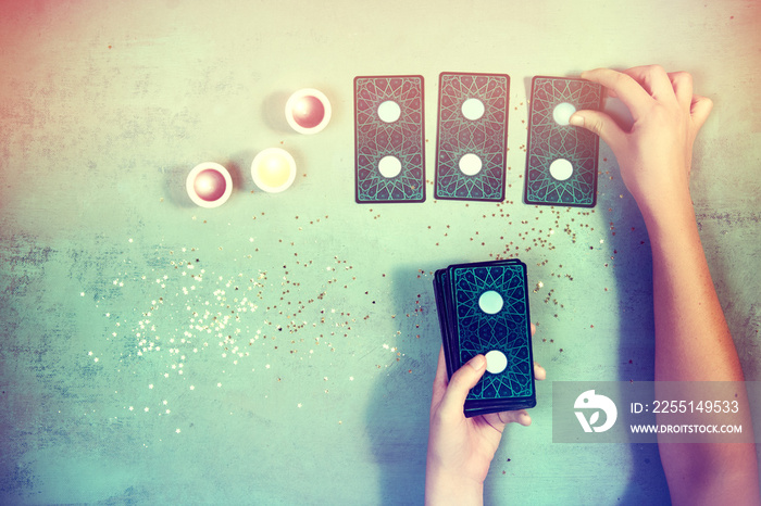 Woman reading the future and fortune in tarot cards