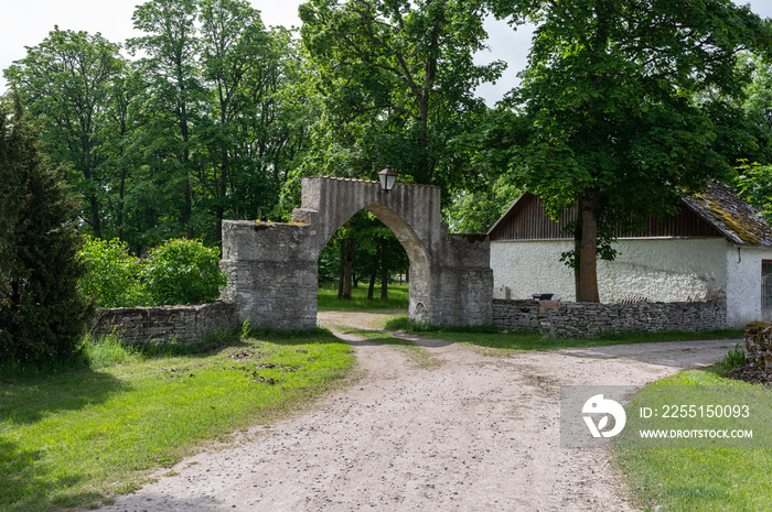 old stone fence with arch