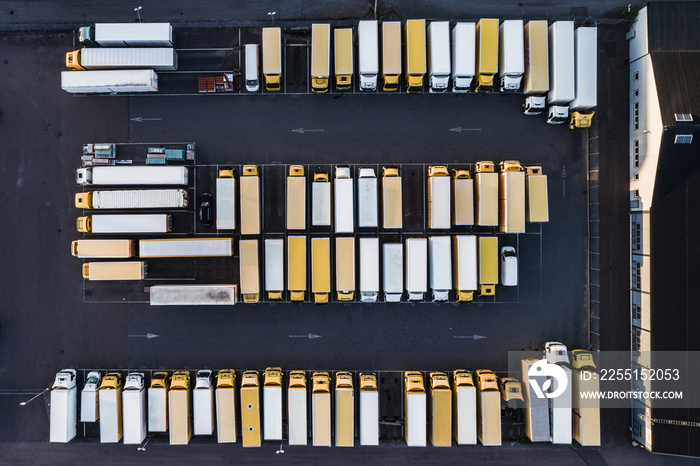 Aerial view of yellow and white trucks