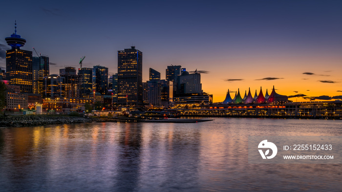 Sunset over the Harbor and the Sails of Canada Place, the Cruise Ship Terminal and Convention Center on the Waterfront of Vancouver, British Columbia, Canada