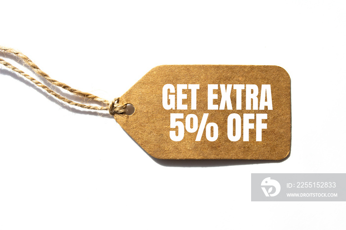 GET EXTRA 5 OFF percent text on a brown tag on a white paper background