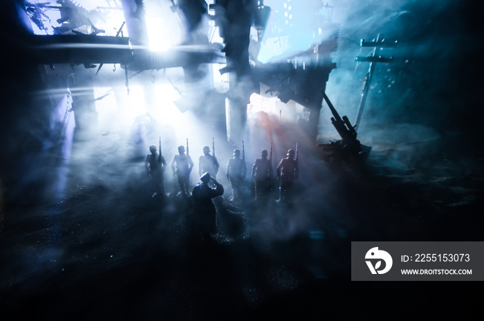 War Concept. Military silhouettes fighting scene on war fog sky background, World War Soldiers Silhouette Below Cloudy Skyline At night.