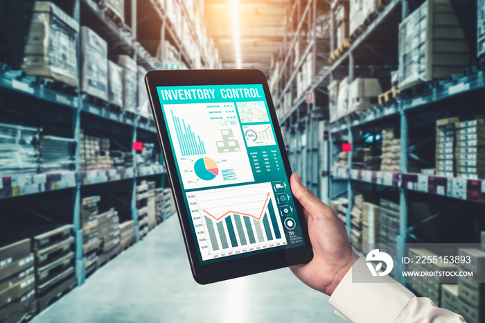 Warehouse management innovative software in computer for real time monitoring of goods package delivery . Computer screen showing smart inventory dashboard for storage and supply chain distribution .