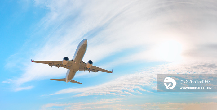 White passenger airplane flying in the sky amazing clouds in the background - Travel by air transport