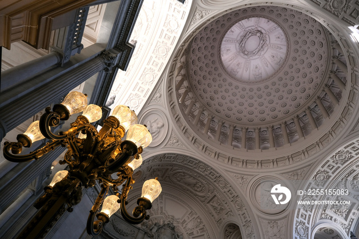 Breathtaking architecture details of panoramic dome columns scenic building interior view with historic walls, chandeliers, brass railings, marble statues in public city hall landmark