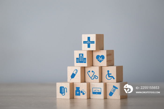 Health Insurance Concept,arranging wood block stacking with icon healthcare medical.