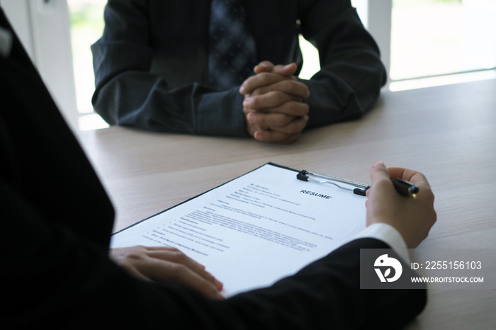 Executives are interviewing candidates. Focusing on resume writing tips, applicant qualifications, interview skills and pre-interview preparation. Considerations for new employees