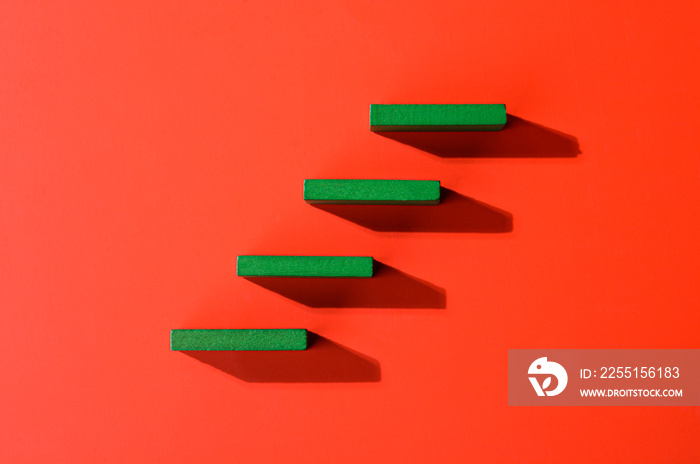 Steps to success. Green steps on red background