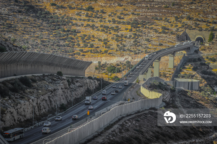 WestBank separation barrier over the highway tunnel along Highway Route 60 from Jerusalem to the bethlehem (Gush Etzion) Jewish settlement bloc in the west bank south of Jerusalem, Beit Jala Palestine