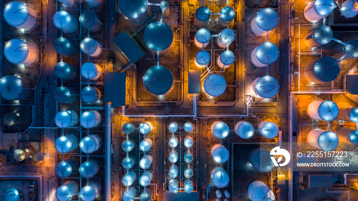 Aerial top view storage tank farm at night, Tank farm storage chemical petroleum petrochemical refinery product at oil terminal, Business commercial trade fuel and energy transport by tanker vessel.