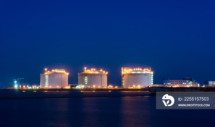 A large oil-refinery plant with Liquefied Natural Gas (LNG) storage tanks