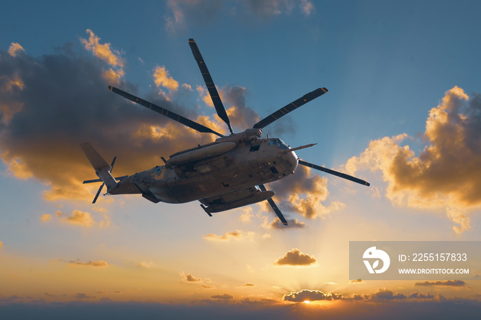 military helicopter at sunset background