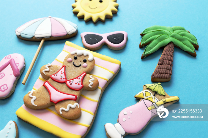 Tropical beach summer theme sweet and delicious sugar cookies, blue background