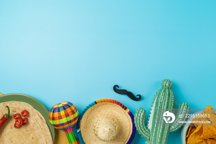 Cinco de Mayo holiday background with Mexican cactus, nachos chips, maracas and party sombrero hat. Top view, flat lay