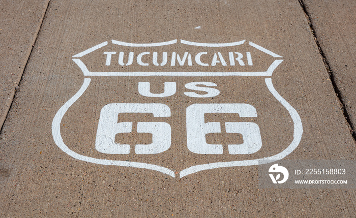 Route 66, Tucumcari US, New Mexico. Sign badge on the road, sunny day.