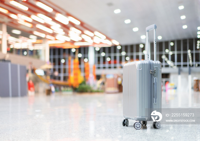 luggage holder on suitcase or bag with TRAVEL INSURANCE ,traveling luggages in an airport terminal,before passenger  and plane flying over sky,Can be used for montage or display your products