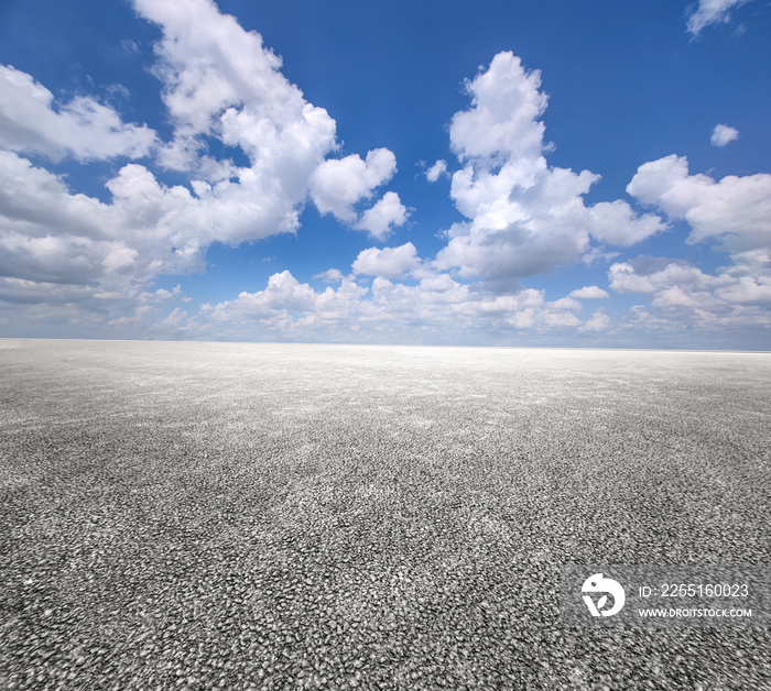 Asphalt road and blue sky with white clouds.