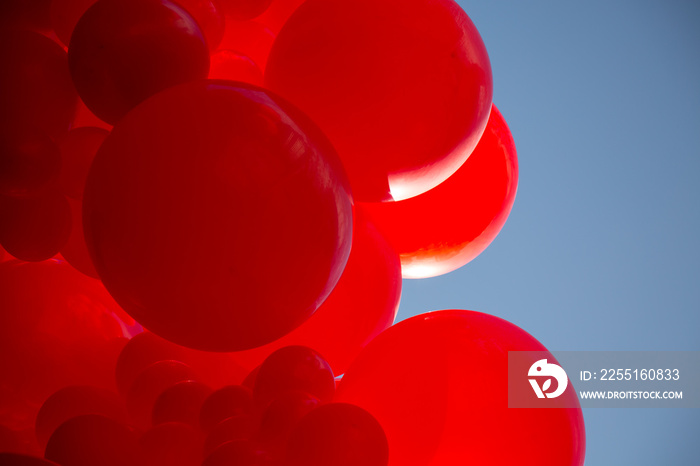 Concept birthday celebration abstract vibrant red ballon bunch