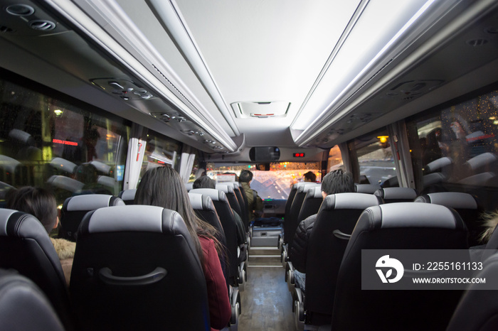 View from back seat in a bus. passengers in the public bus,